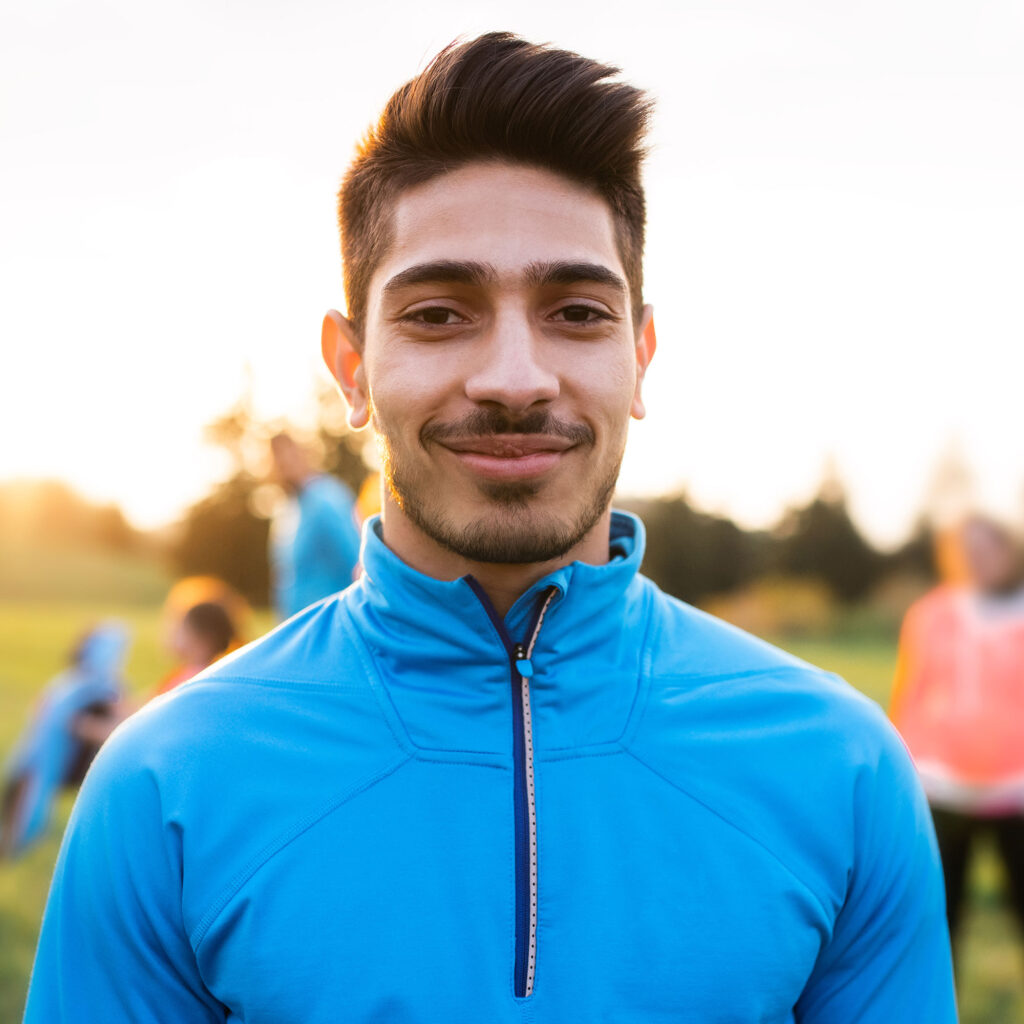 a-portrait-of-young-man-with-large-group-of-people-P5PB6Y9.jpg